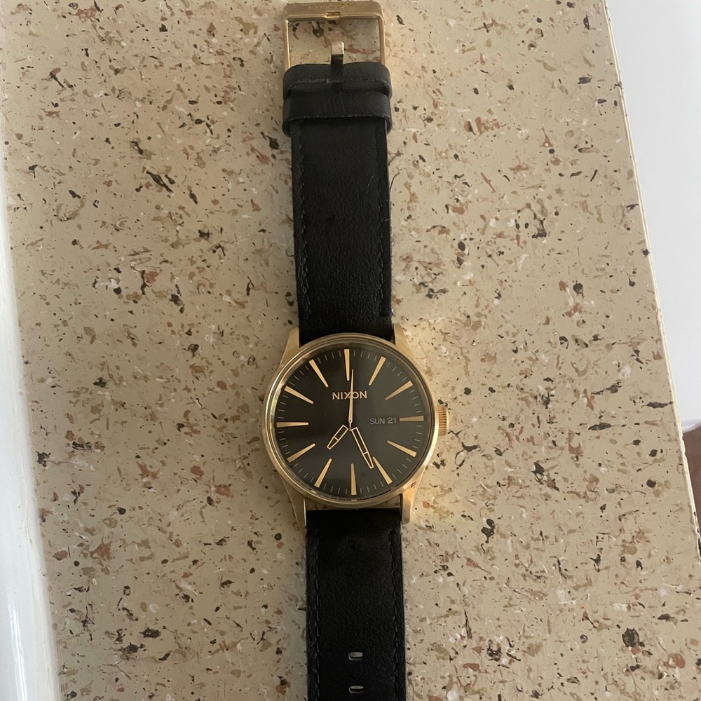 Brand new hardly used Black& Gold Nixon Watch